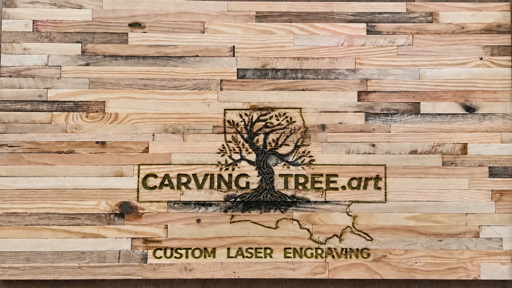 Custom laser-engraved rustic wood desktop with CarvingTree.art logo CarvingTree.art logo and Louisiana outline custom laser engraving on a reclaimed rustic wood desktop with epoxy edges